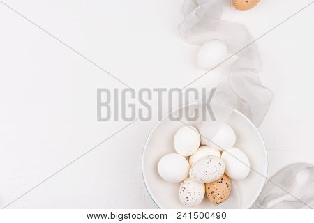 Stylish Background With White And Yellow Easter Eggs In Bowl And Silk Fabric With Copy Space. Isolat