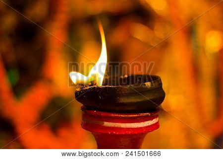 Lit Clay Lamp On Top Of A Clay Stand Or Worship Idol Durgapuja India Diwali
