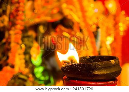 Lit Clay Lamp On Top Of A Clay Stand Or Worship Idol Durgapuja India Diwali
