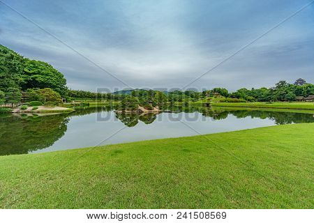Pond In The Middle Of Beautiful Japanese Garden