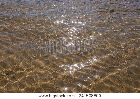 Crystal Clear Water Of The Tropical Sea. Abstract Water Background. Sun Light And Clear Sea Water Te