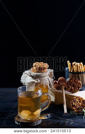 A Fragrant Flower Tea With Delicious Cookies On The Table