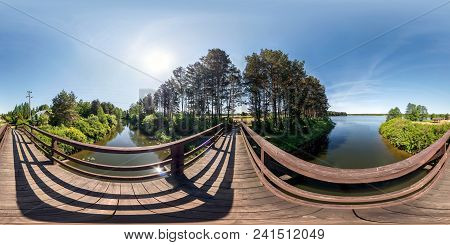 Full Seamless Panorama 360 By 180 Angle View On Wooden Bridge Across Water Canal Against Backdrop Of