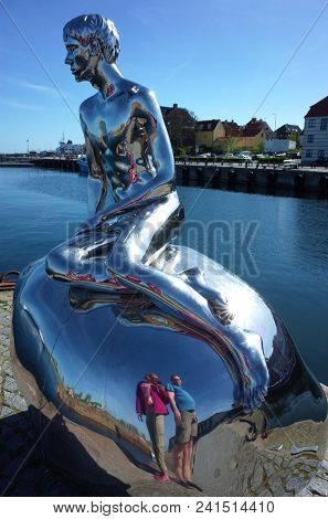 Helsingor, Denmark - 06 May, 2018: Tourists reflecting in sculpture 