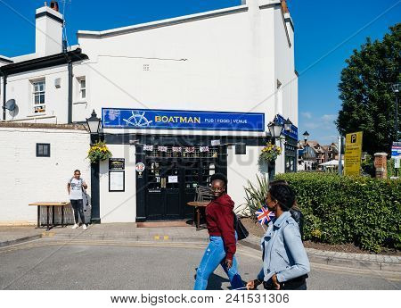 Windsor, Berkshire, United Kingdom - May 19, 2018: Two Black Ethnicity Girls Walking To Royal Weddin