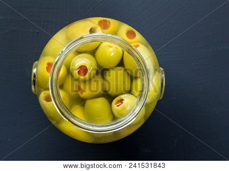 Jar Of Stuffed Green Olives In Brine Close Up Top View Photo With Copy Space For Text