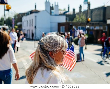 Windsor, United Kingdom - May 19, 2018: Senior Woman Selling American Usa Flags For Royal Wedding Ma