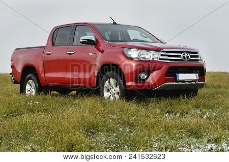 Slany, Czech Republic - November 10, 2016: Red Toyota Hilux In Slany, Czech Republic, November 10, 2