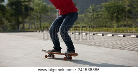 One Young Skateboarder Sakteboarding On Parking Lot