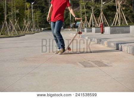 One Young Skateboarder Sakteboarding On Parking Lot