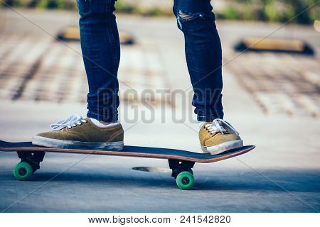 One Skateboarder Legs Skateboarding On Paking Lot