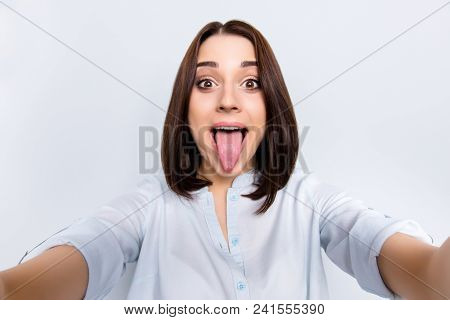 Self Portrait Of Pretty, Charming, Comic, Childish, Funny Girl With Modern Hairstyle Gesture Tongue 