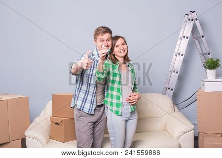 Happy Woman In Her New Home Holding Key