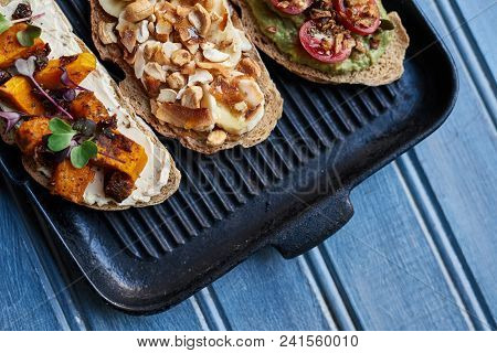 High Angle Of A Variety Of Delicious Open Faced Sandwiches With An Assortment Of Ingredients Sitting