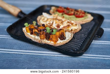 Closeup Of A Variety Of Delicious Open Faced Sandwiches With An Assortment Of Ingredients Sitting In