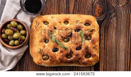 Traditional Italian Focaccia With Olives, Rosemary - Homemade Flat Bread Focaccia. Rustic Style. Top
