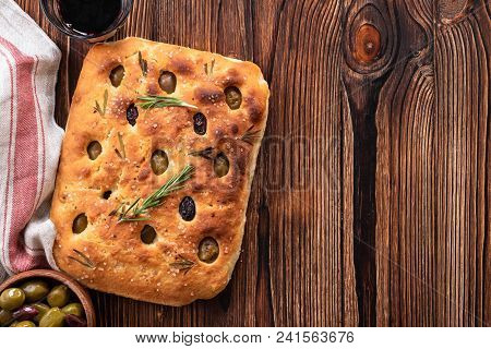 Traditional Italian Focaccia With Olives, Rosemary - Homemade Flat Bread Focaccia. Rustic Style. Top