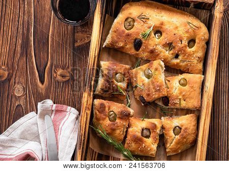 Traditional Italian Focaccia With Olives, Rosemary - Homemade Flat Bread Focaccia. Rustic Style. Top