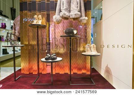 MILAN, ITALY - CIRCA NOVEMBER, 2018: shop window display of clothing and shoes at a store in Milan, Italy.