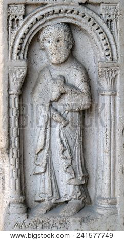 MODENA, ITALY - JUNE 04: Saint Matthias the apostle, bass relief by followers of Wiligelmo, Princes Gate, Modena Cathedral, Italy on June 04, 2017.