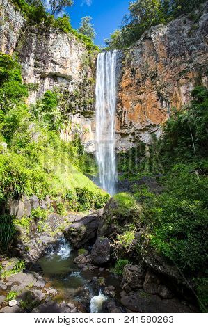 The Majestic And Iconic Purling Brook Falls On A Warm Autumn Day In Springbrook National Park Near T