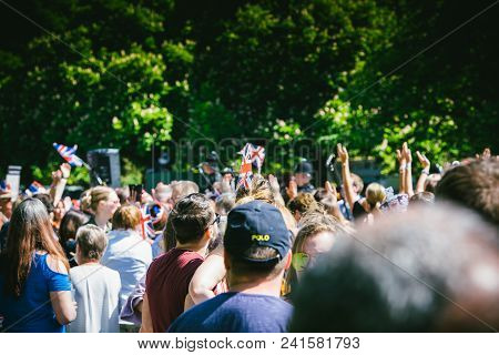 Windsor, , United Kingdom - May 19, 2018: Crowd Applauding The Royal Wedding Limousine Cortege Durin