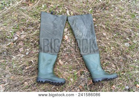 Boots For Fishing On Dry Grass. Fishing Wellingtons