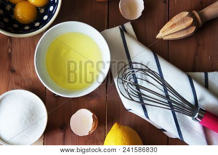 Separation The Yolk Of Egg In Little Bowl And And Preparation For The Whisking Of Egg Whites And Yol