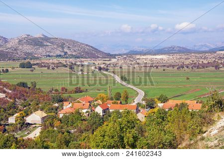 Karst Field Landscape.  Bosnia And Herzegovina, Zubacko Polje. View Of Village Of Grab And Road To C
