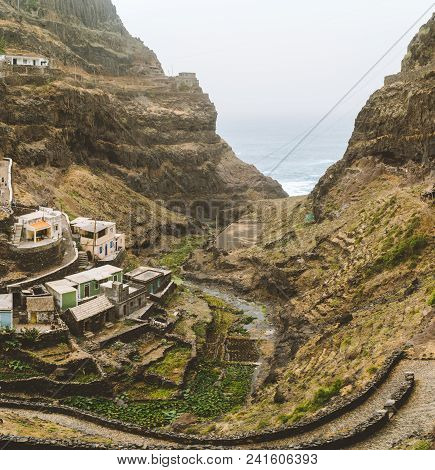 Settlement In The Rocky Coast Of Santo Antao Island. Houses Nestle Into The Sides Of Bluff Ridge. Fo