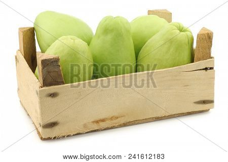 Chayote fruit (Sechium edulis)and a cut one on a white background