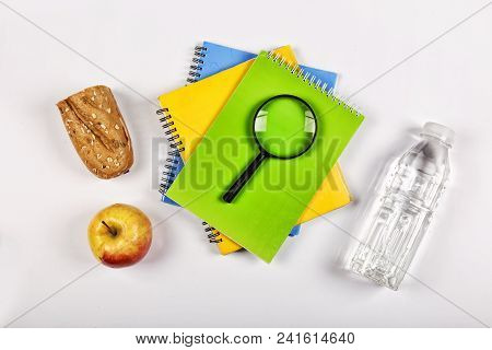 Back To School Concept. School Snack. Appetizing Sandwich, Apple In Lunch Box And Magnifier On White