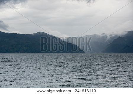 Lake Toba Is A Large Natural Lake Occupying The Caldera Of A Supervolcano, Located In The Middle Of 