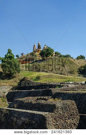 Ruins Of Cholula Pyramid With Church Of Our Lady Of Remedies At The Top Of It - Cholula, Puebla, Mex