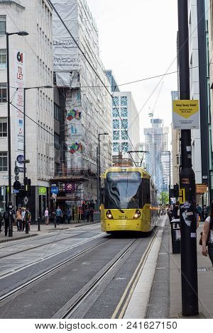 A Tram On The Metrolink Light Rail System In The City Centre Of