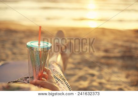 Back View On A Woman Enjoying Sunset With Cocktail In Albania At Adriatic Sea Sandy Coast Durres Gol