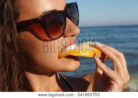 Summer Vacation - Young Girl Eating Fresh Watermelon On Sandy Beach