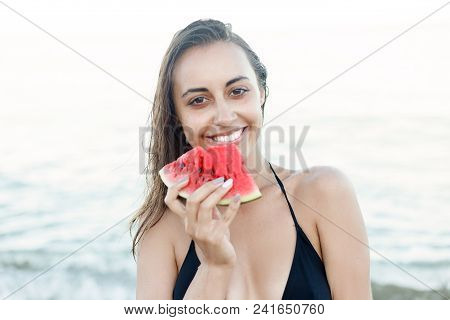 Summer Vacation - Young Girl Eating Fresh Watermelon On Sandy Beach