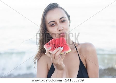 Summer Vacation - Young Girl Eating Fresh Watermelon On Sandy Beach
