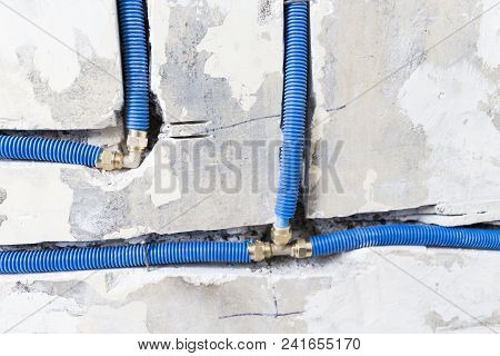 Water Pipes Made Of Polypropylene Pex In The Wall, Plumbing In The House. Installation Of Sewer Pipe