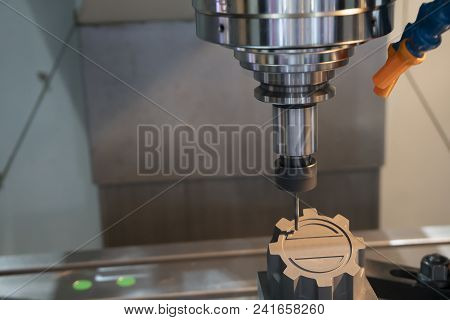 The Cnc Milling Machine Cutting The Graphite Electrode Part With The Solid Ball Endmill. Modern Manu