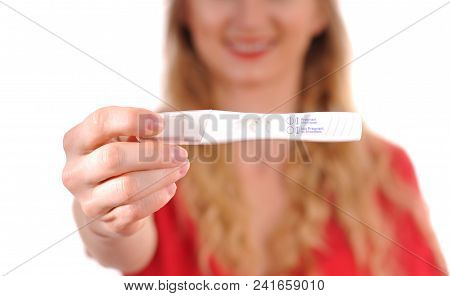 Pregnant Test. Happy Woman Showing A Positive Pregnancy Test