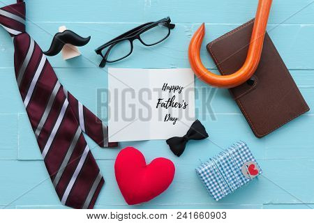 Happy Fathers Day Concept. Red Tie, Glasses, Mustache, Notebook, Gift Box With Happy Father's Day Te