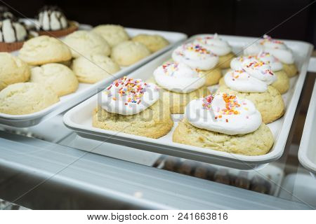 Artisanal Cupcakes And Cookies At A Bakery On Display