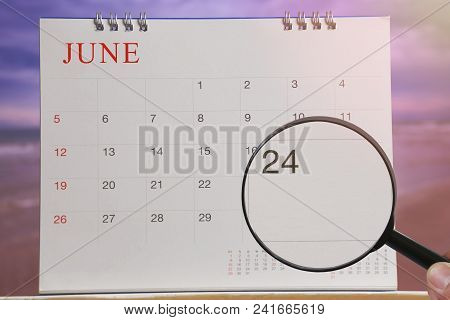 Magnifying Glass In Hand On Calendar You Can Look Twenty-four Day Of Month,focus Number Twenty-four 