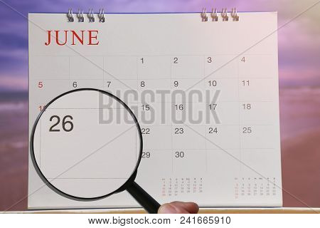 Magnifying Glass In Hand On Calendar You Can Look Twenty-six Day Of Month,focus Number Twenty-six In