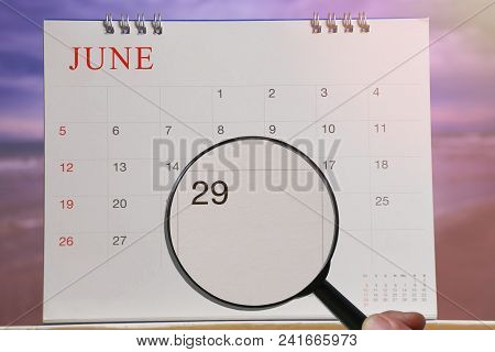 Magnifying Glass In Hand On Calendar You Can Look Twenty-nine Day Of Month,focus Number Twenty-nine 