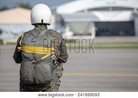 One Police Aerial Reinforcement Unit In Camouflage Uniform And Helmet With T-10 Static Line Parachut