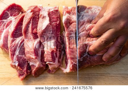 Overhead View Of Raw Piece Of Pork On Wooden Background. Piece Of Fresh Boneless Pork, Neck Part Or 