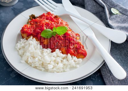 Flounder With Tomato Sauce And Boiled Rice, Selective Focus